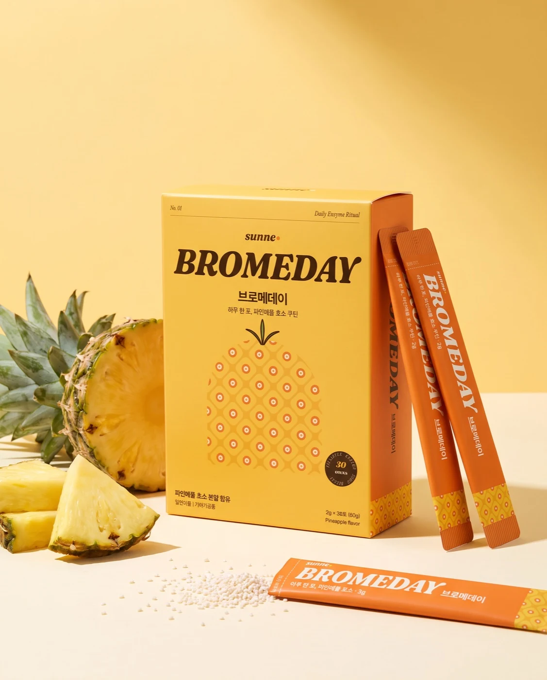 Bromeday yellow box and orange sticks with pineapple