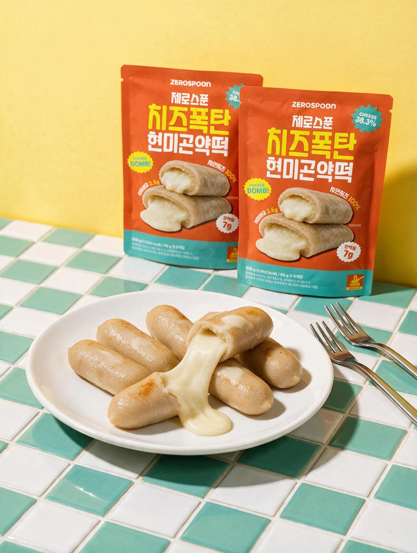 Tteok packs and a plate on a green checked tablecloth